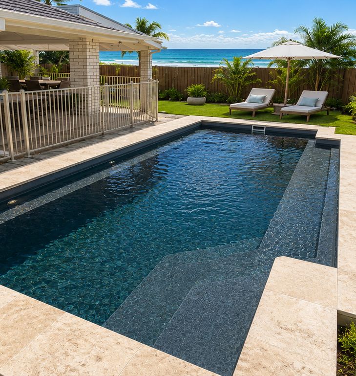 Dark fibreglass pool beside a beachside home