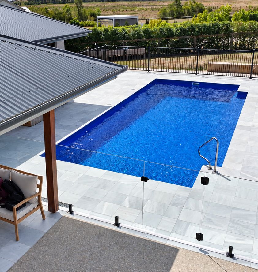 Fibreglass pool beside a home